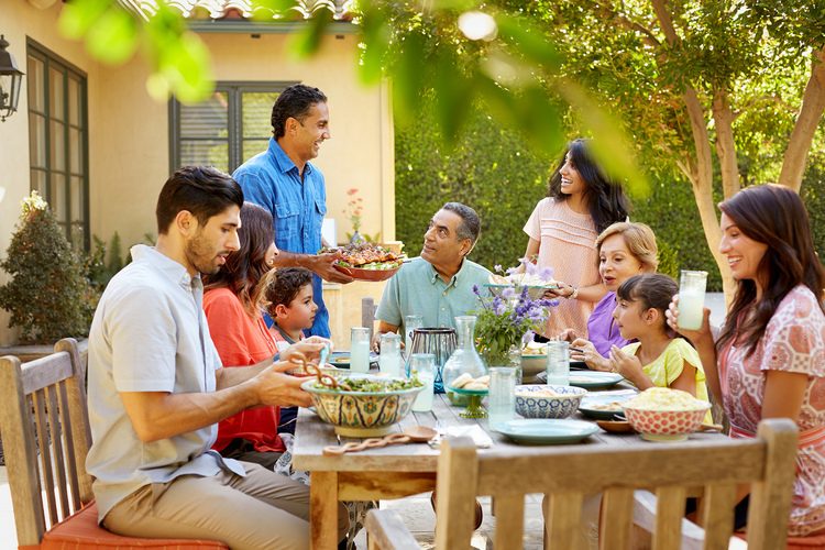 family at outdoor table